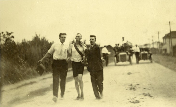 T.J. Hicks of Cambridge, Massachusetts. Winner of Marathon Foot-Race being sponged by attendants. 1904 Olympics.