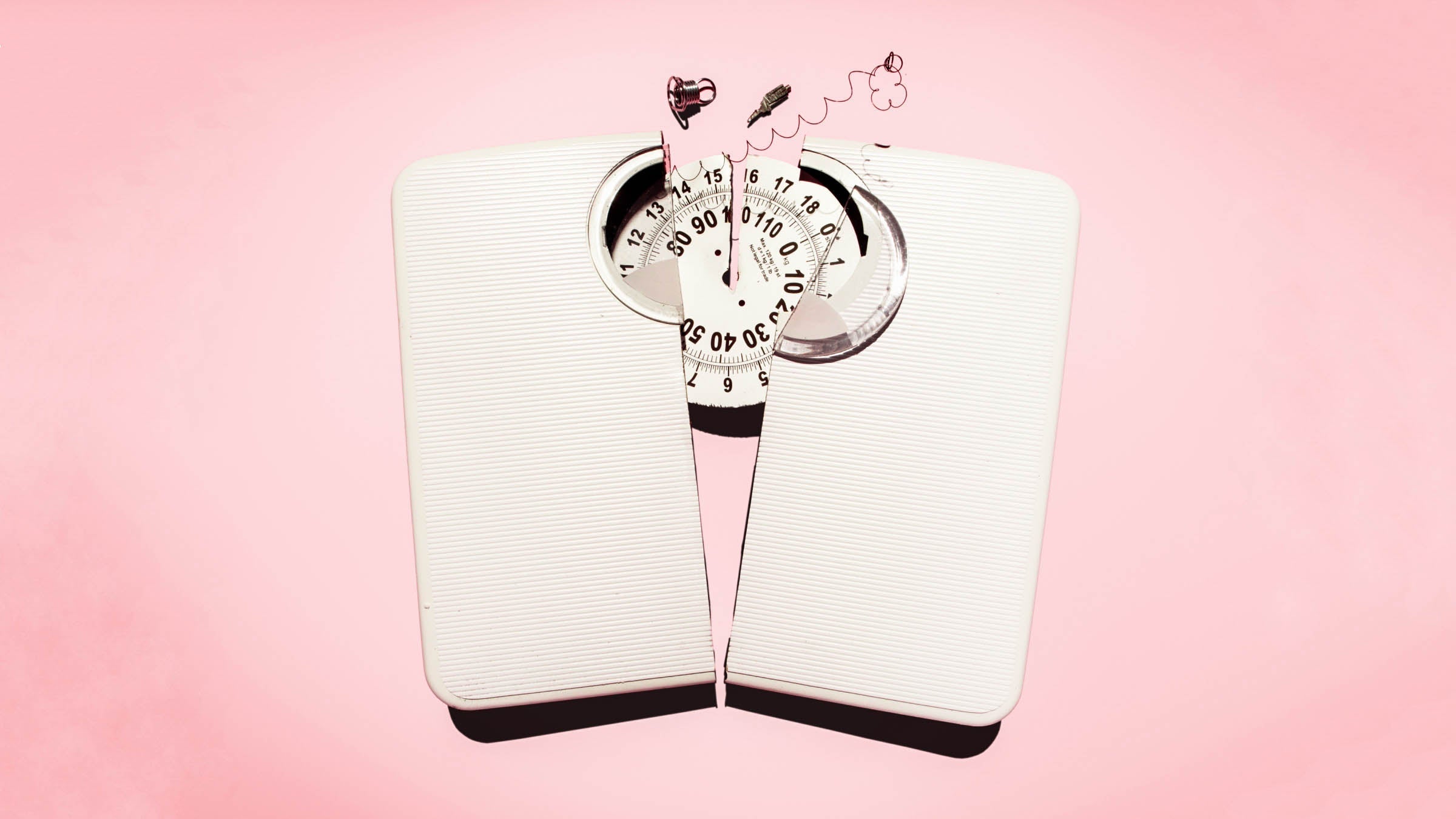 Broken scale on pink background