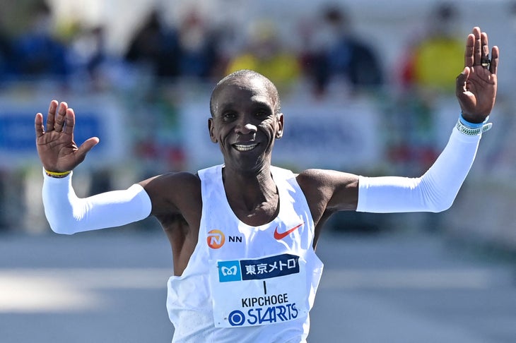 Eliud Kipchoge raises his arms at the finish of the Tokyo Marathon