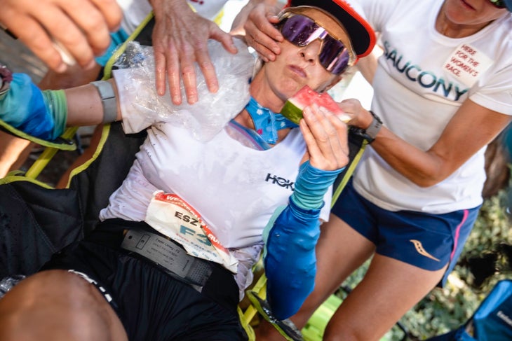 Eszter Csillag refuels and cools down at the Forest Hill aid station (mile 62).