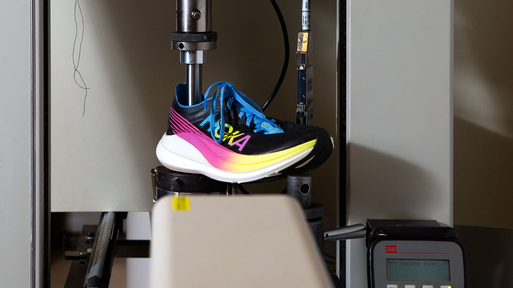 Super shoe being tested for midsole softness in the Outside Lab
