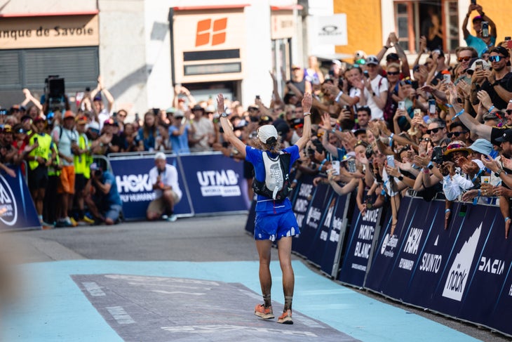 Katie Schide waves to the crowd after winning her second UTMB.