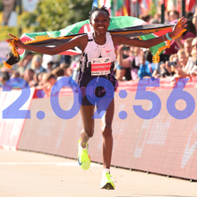 Ruth Chepngetich of Kenya crosses the finish line to win the 2024 Chicago Marathon professional women's division and sets a new world record with a time of 2:09:56 at Grant Park on October 13, 2024 in Chicago, Illinois.