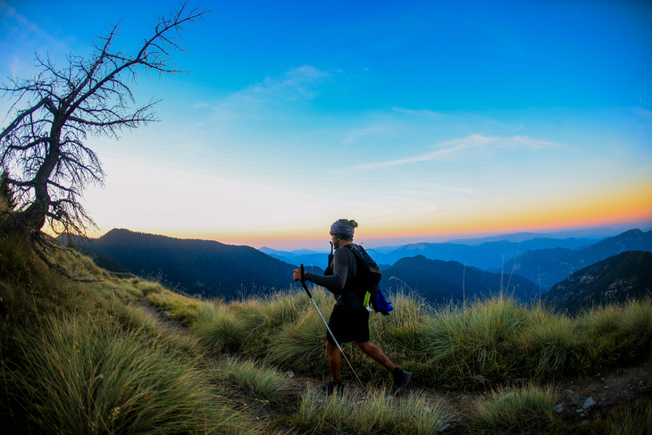 A racer runs through sunrise during the 100-miler.