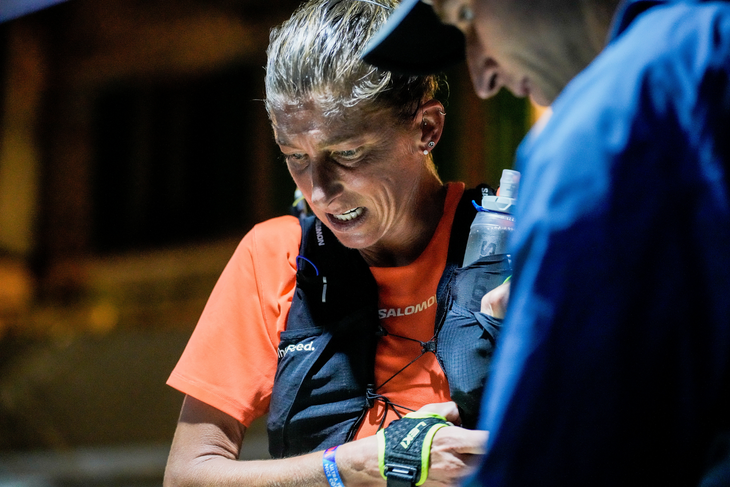 Courtney Dauwalter receives help from her husband Kevin at an aid station.