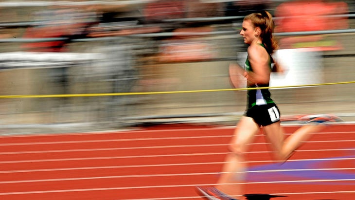 A blurred image of runner on the track.