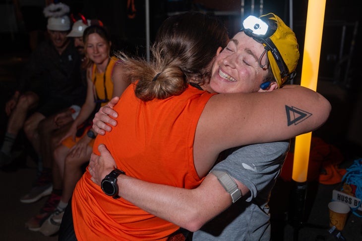 Riley Brady hugs their mom after winning the Javelina Jundred.