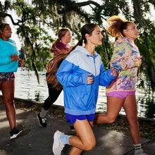 a group of women running to promote Every Woman's Marathon