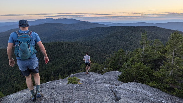 Will Peterson runs down a rocky outcropping of the Long Trail.