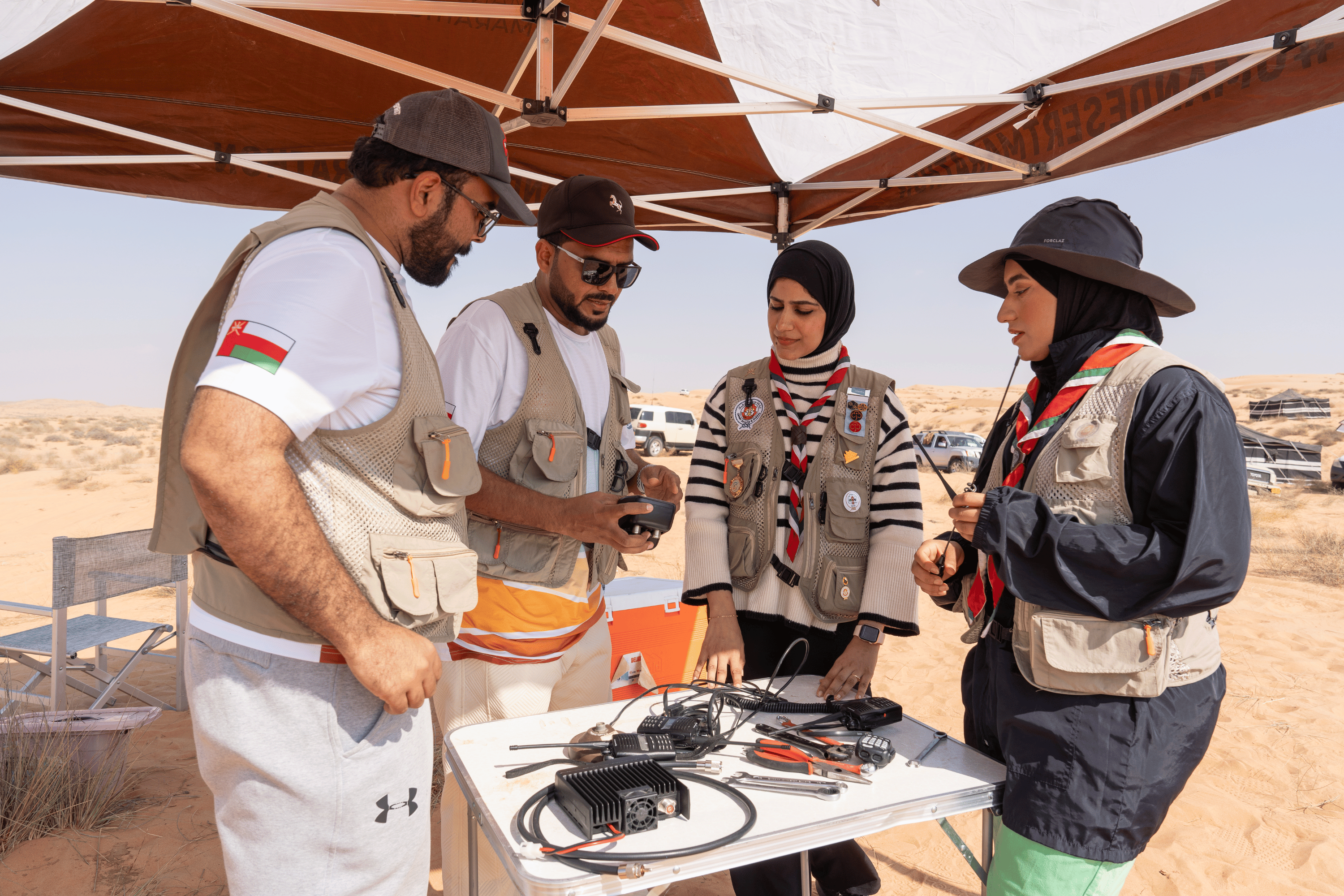 Safety officials convene at the Oman Desert Marathon.