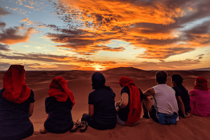 Runners take in the sunset views in the Sahara 