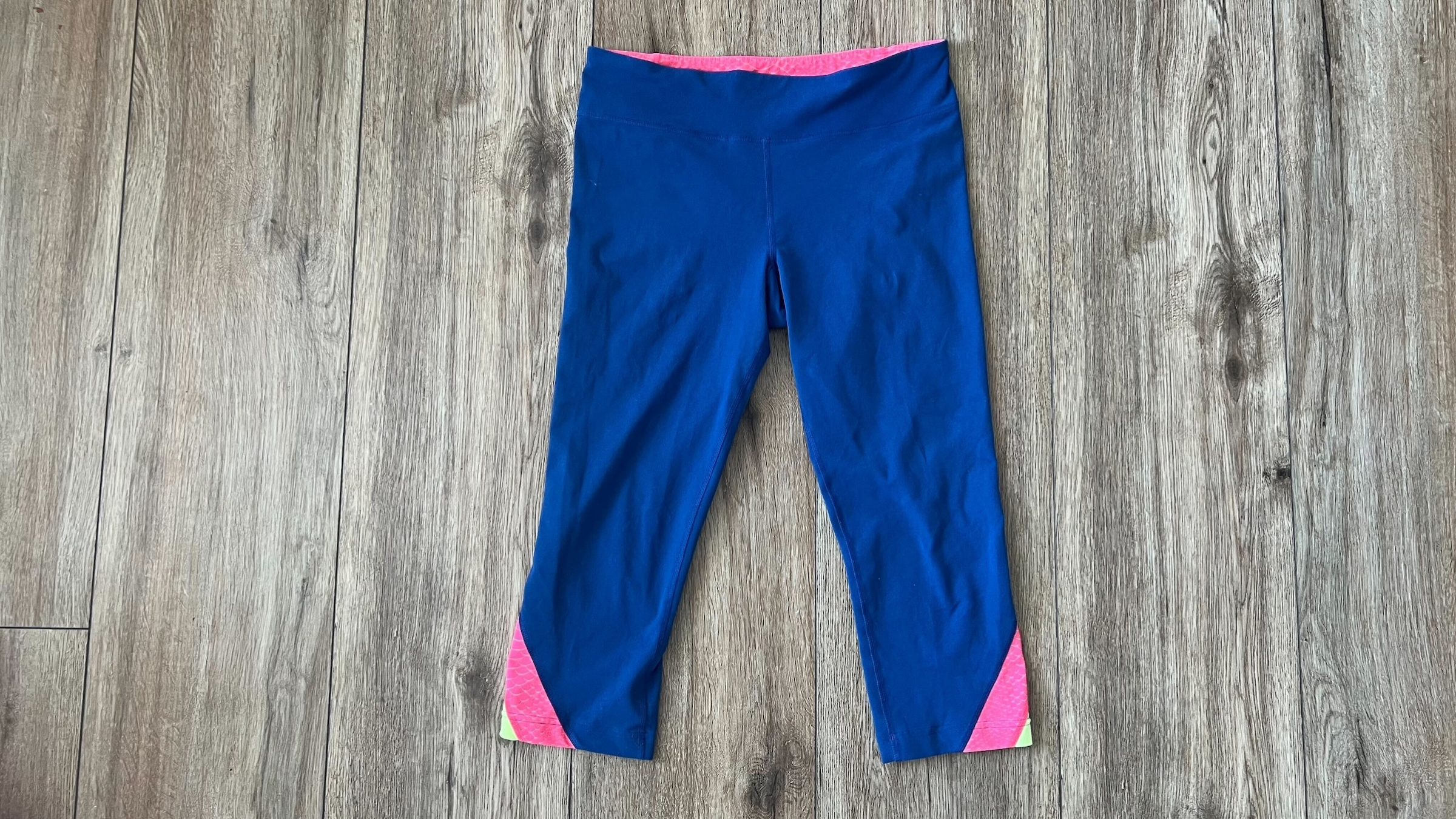 a pair of blue and pink leggings 