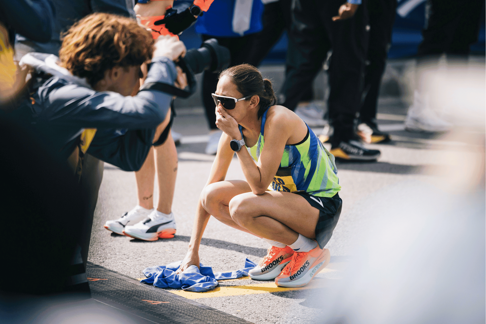 Des Linden shows some emotion as the Boston Marathon announcer recognizes past winners and shares that this will be Linden's last professional race.