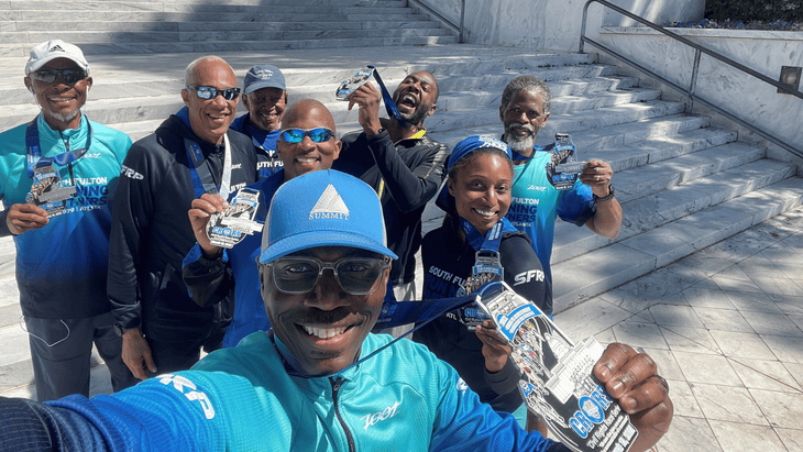 Members of the running group South Fulton Running Partners smile for the camera after a race.
