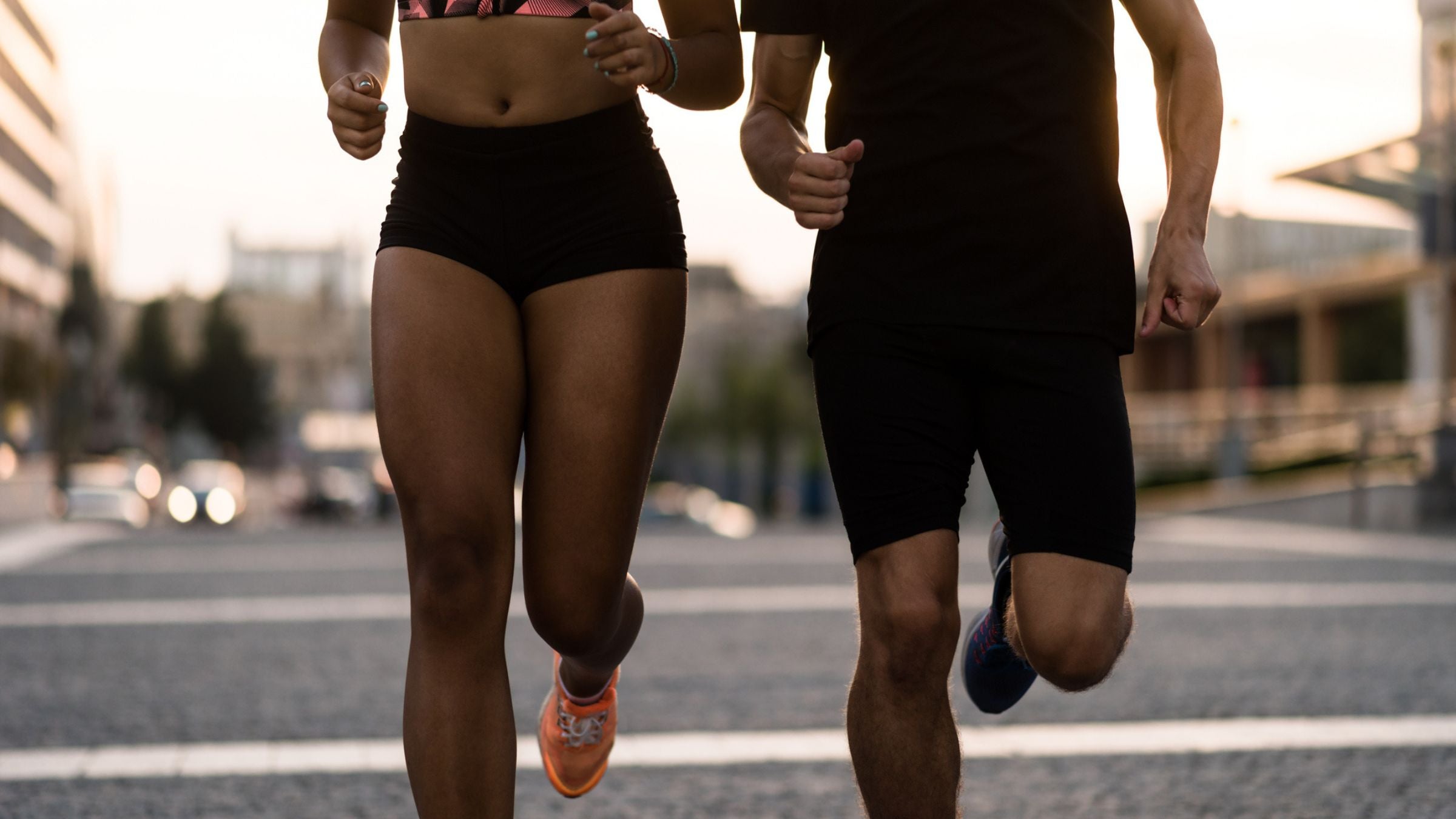 a male and a female running in summer time