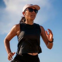a woman running in the summer