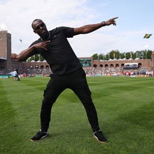 The legendary Usain Bolt doing his signature pose.