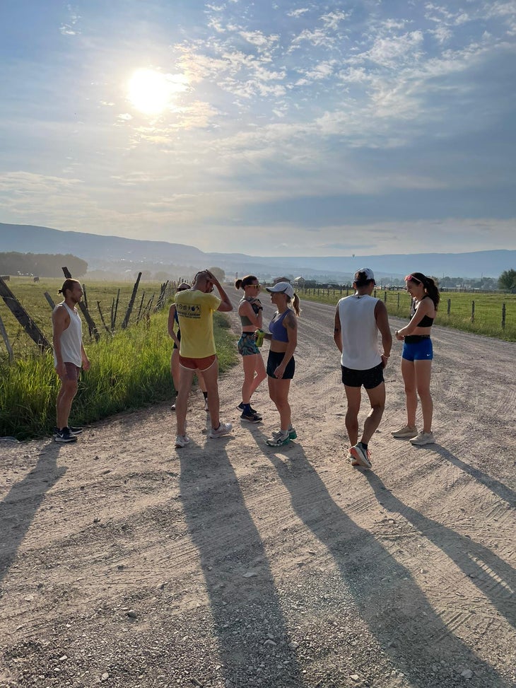runners gather on a dirt road