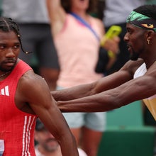 EUGENE, OREGON - AUGUST 03: Noah Lyles is pushed by Kenny Bednarek following the Xfinity Men's 200m final during the 2025 USATF Outdoor Championships at Hayward Field on August 03, 2025 in Eugene, Oregon.