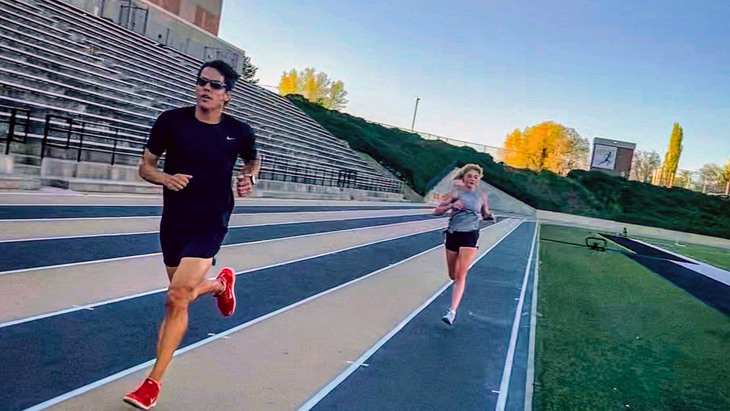 running workouts with scott browning leading the way and a younger woman athlete trailing