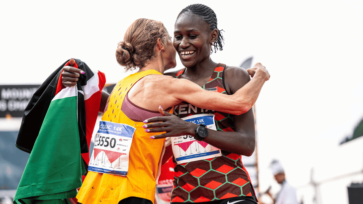 Nina Engelhard and Joyce Njeru embrace after finishing first and fourth in the women’s Classic race.