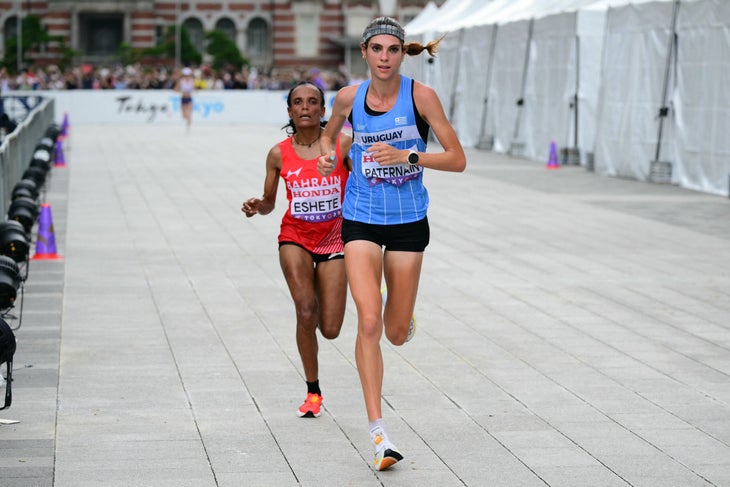 Bahrain's athlete Shitaye Eshete (L) and Uruguay's athlete Julia Paternain compete in the women's marathon final during the World Athletics Championships in Tokyo on September 14, 2025. 