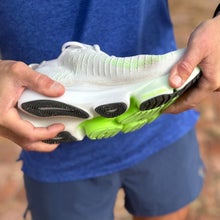 Brooks Glycerin Flex being flexed by a runner's hands