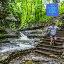 a man scrambling down steps in Ithaca, NY