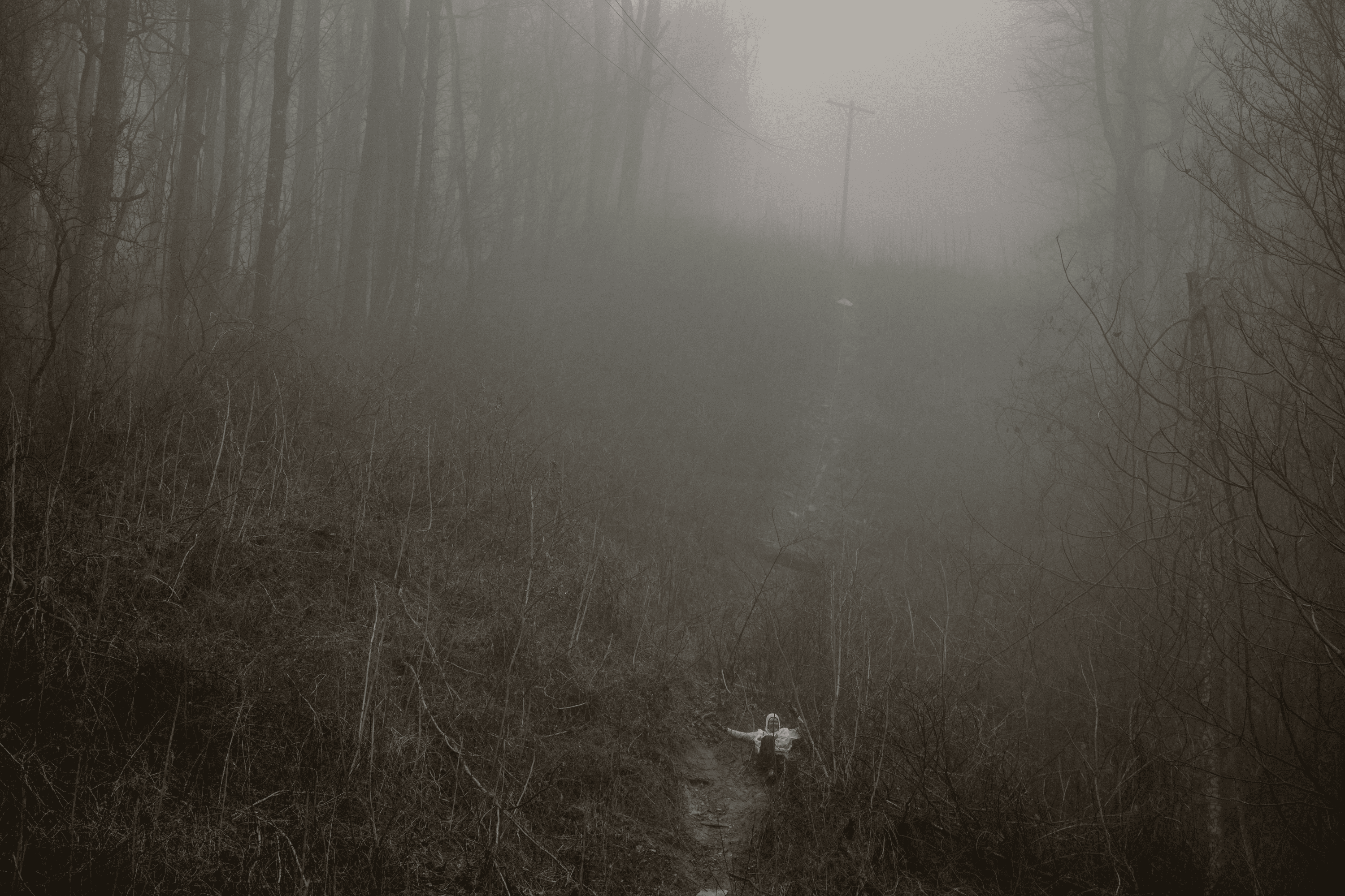 Sébastian Raichon slips in the mud on the way back to camp. 