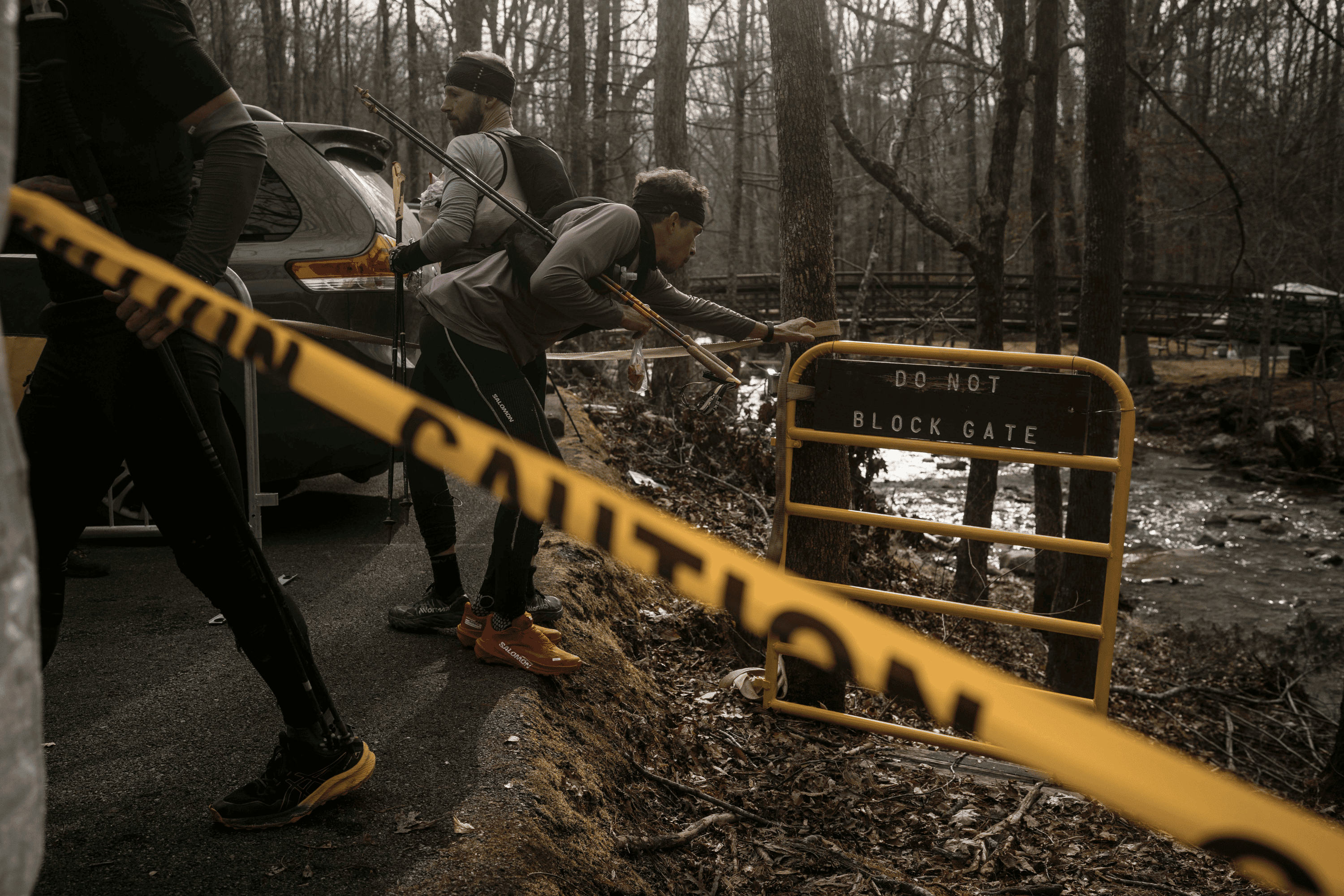 Mathieu Blanchard, a French ultrarunning star, and the U.K.’s Damian Hall, who’s made it onto loop 5 twice before, touch the gate marking the finish of loop 1 so they can be issued their new bibs for loop 2. Bib numbers correspond to the page runners must rip from each of 16 books hidden along the course to prove they’ve completed the full loop.