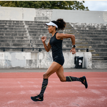 a woman running on the track
