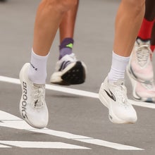 Sabastian Sawe of Team Kenya celebrates with his adidas shoe after winning with a new World Record time during the Men’s 2026 TCS London Marathon on April 26, 2026 in London, England.