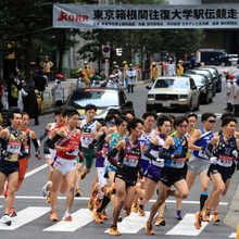 a group of runners rounding a turn