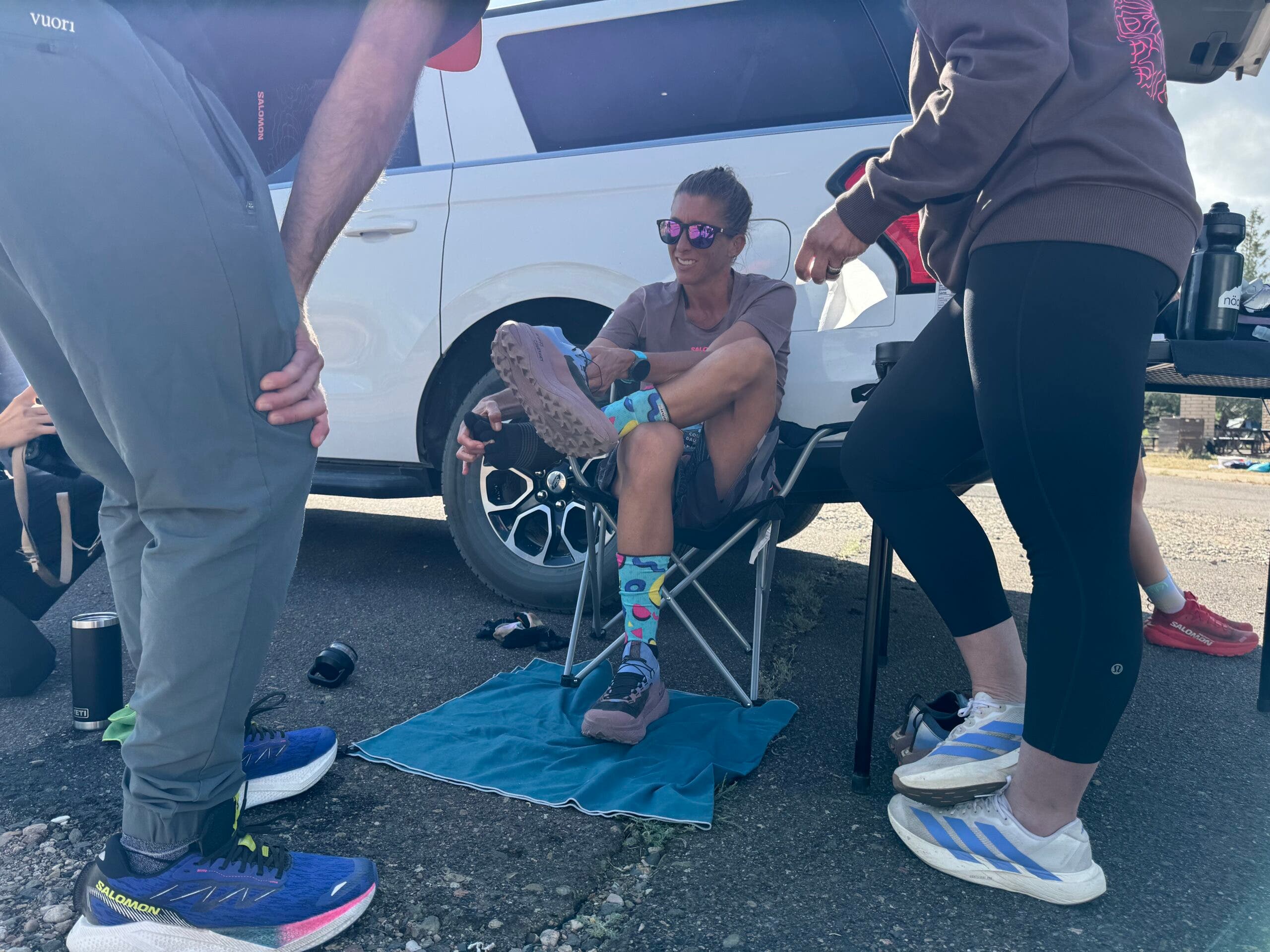Third place woman Courtney Dauwalter changes shoes at Dead Horse aid station, mile 133.3.