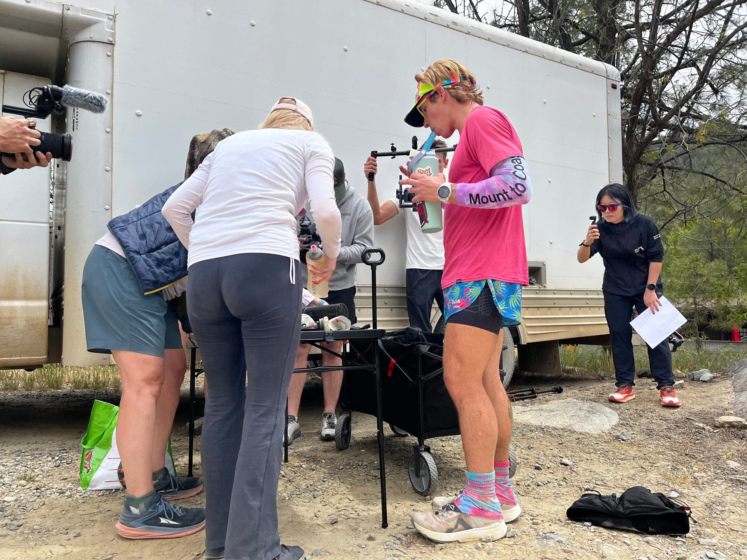 Kilian Korth refuels at the Crown King aid station, mile 36.6.
