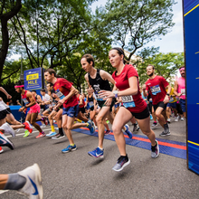 Runners at the start of the iconic 5th Avenue Mile are all smiles.
