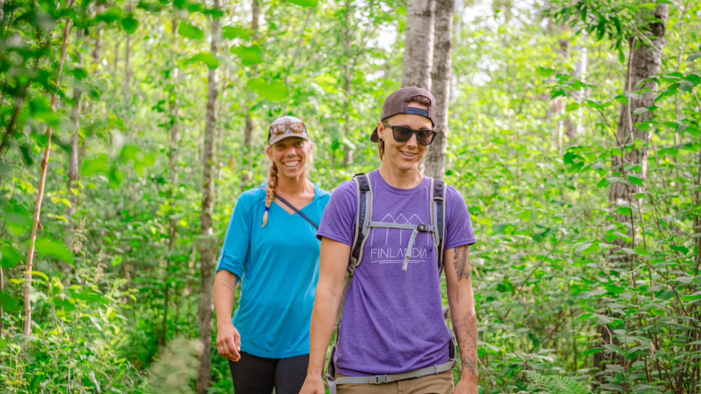 Two hikers in the woods in Duluth, MN.