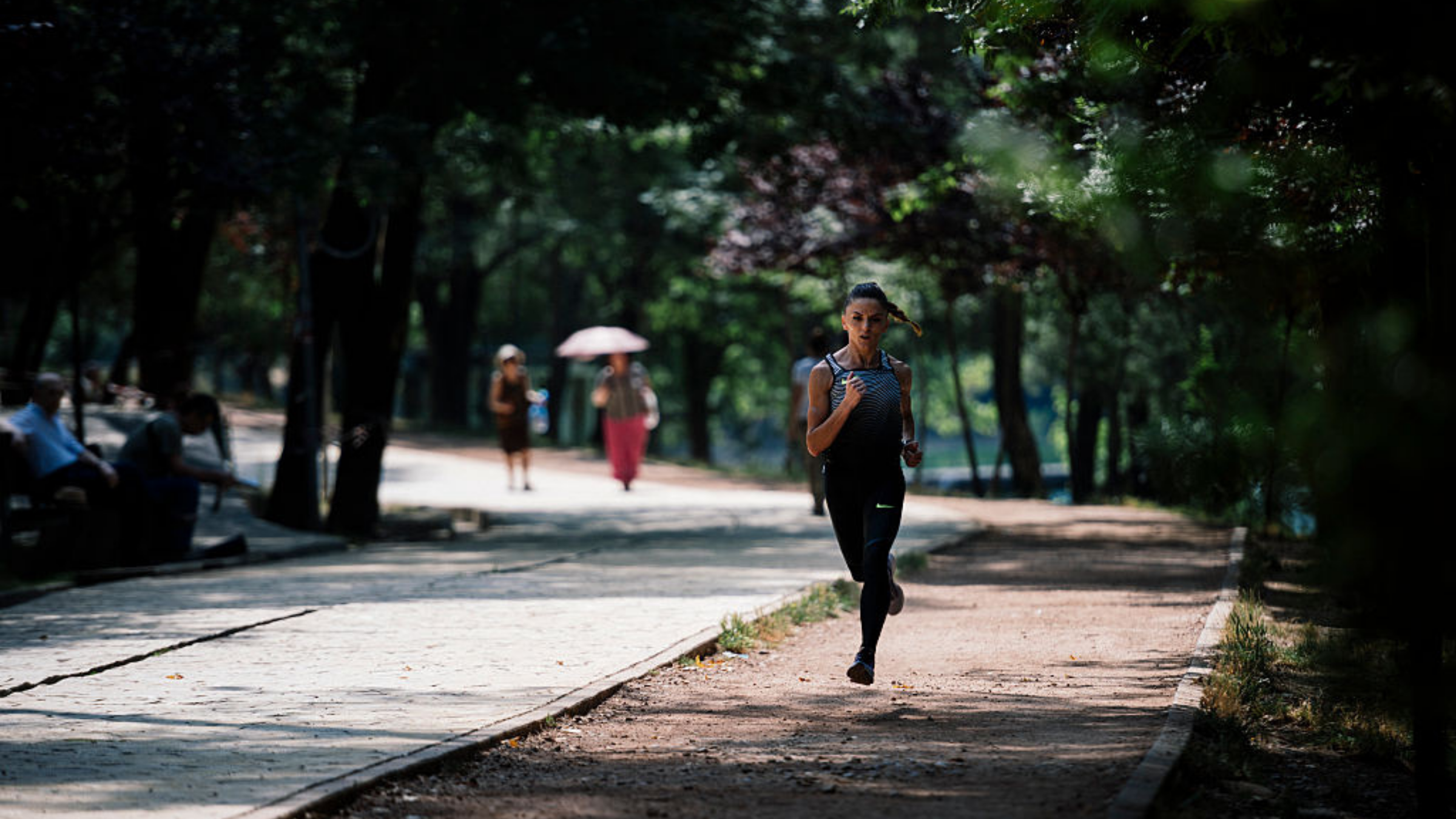 Albanian athlete Luiza Gega runs during a training session in Tirana Park.