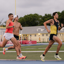 men running on a track