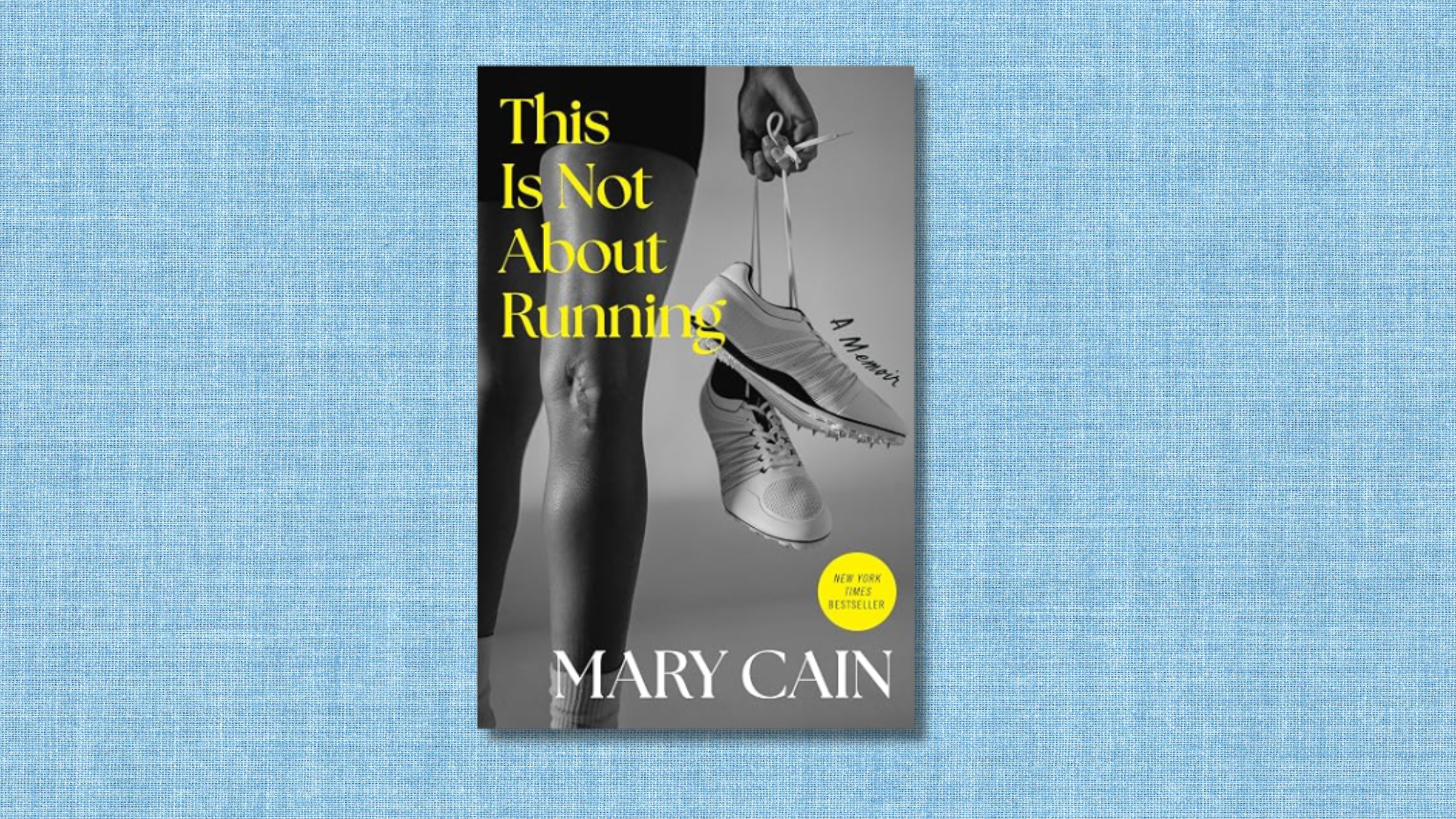 blue textured background with Mary Cain's book cover of black and white photo of woman holding track spikes