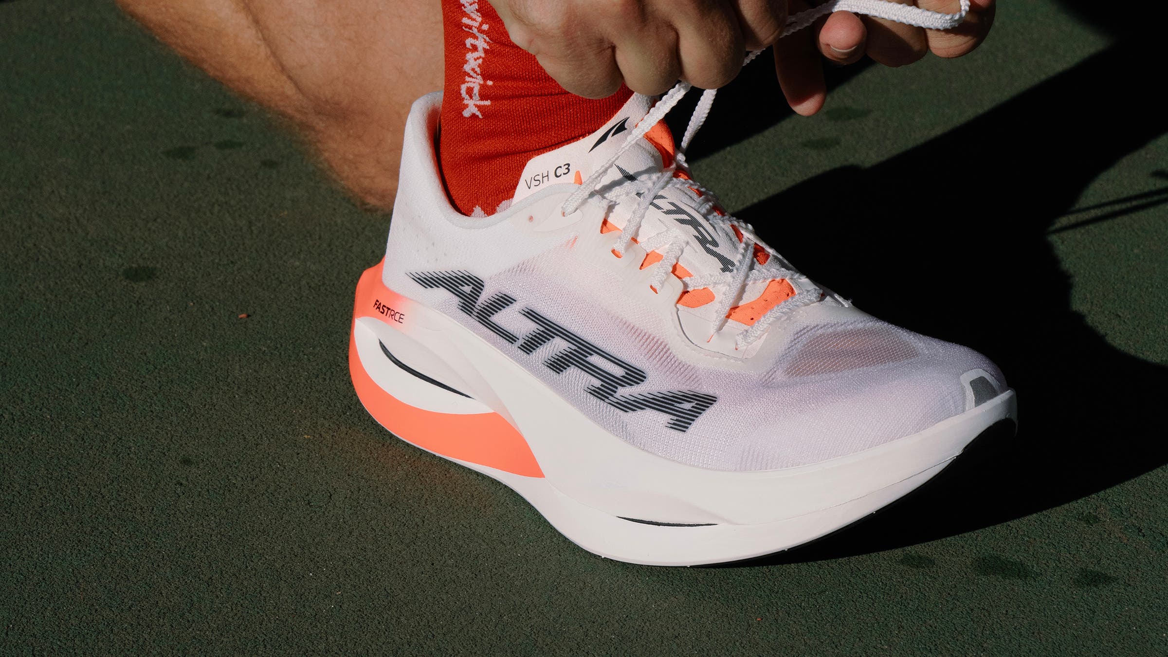 Altra Vanish Carbon 3 super shoe being laced up before a race