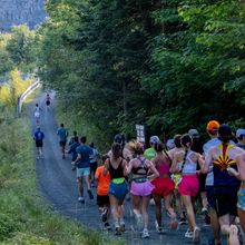 a line of runners on a pathway