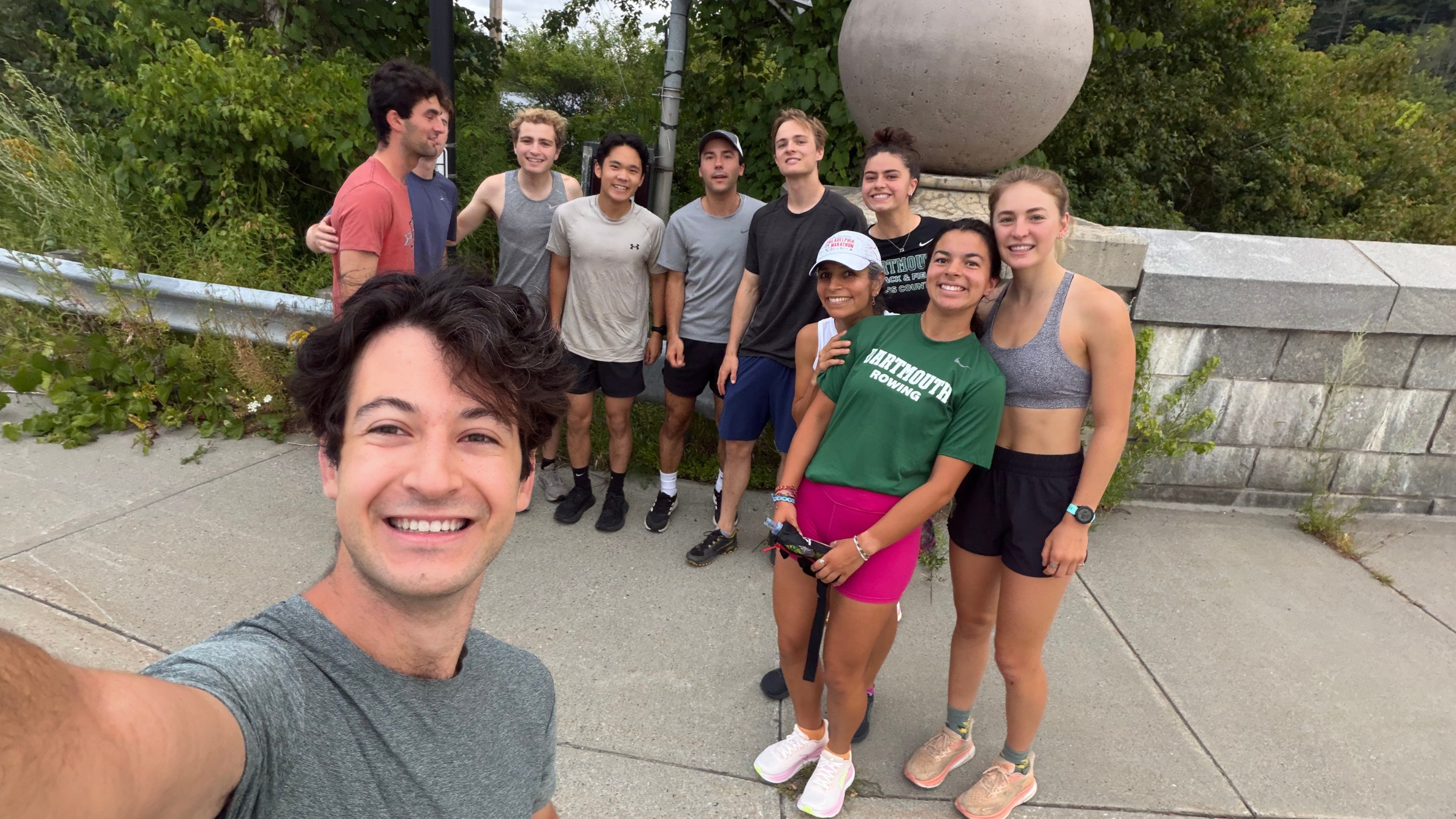 group of college students taking a break from running half marathon