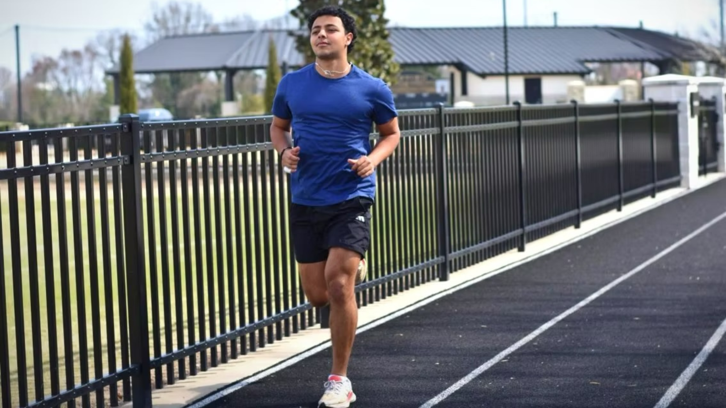 Joe Khalil in blue shirt runs to raise money