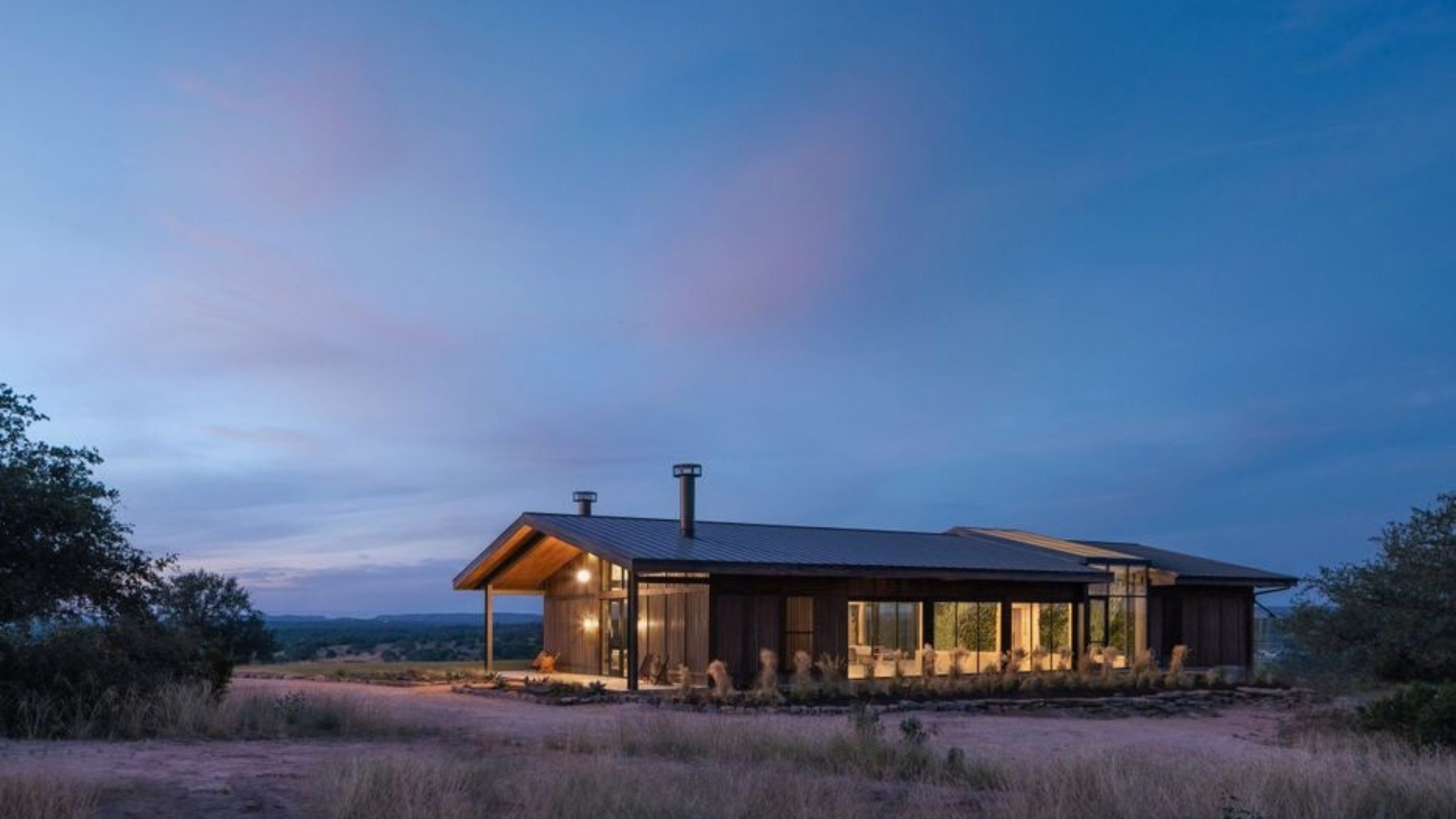 a cabin under an evening sky