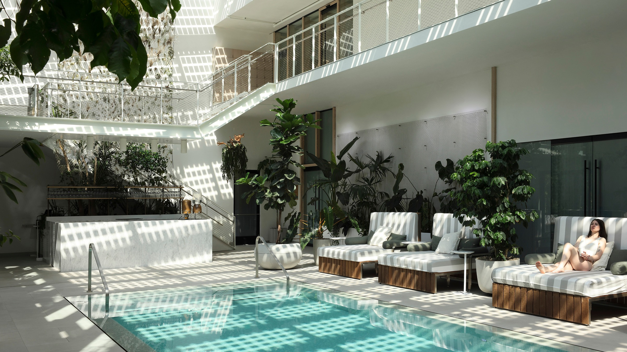 a beautiful pool with overhead lights 