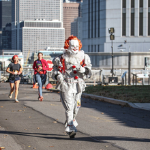 a really scary looking doll costume running